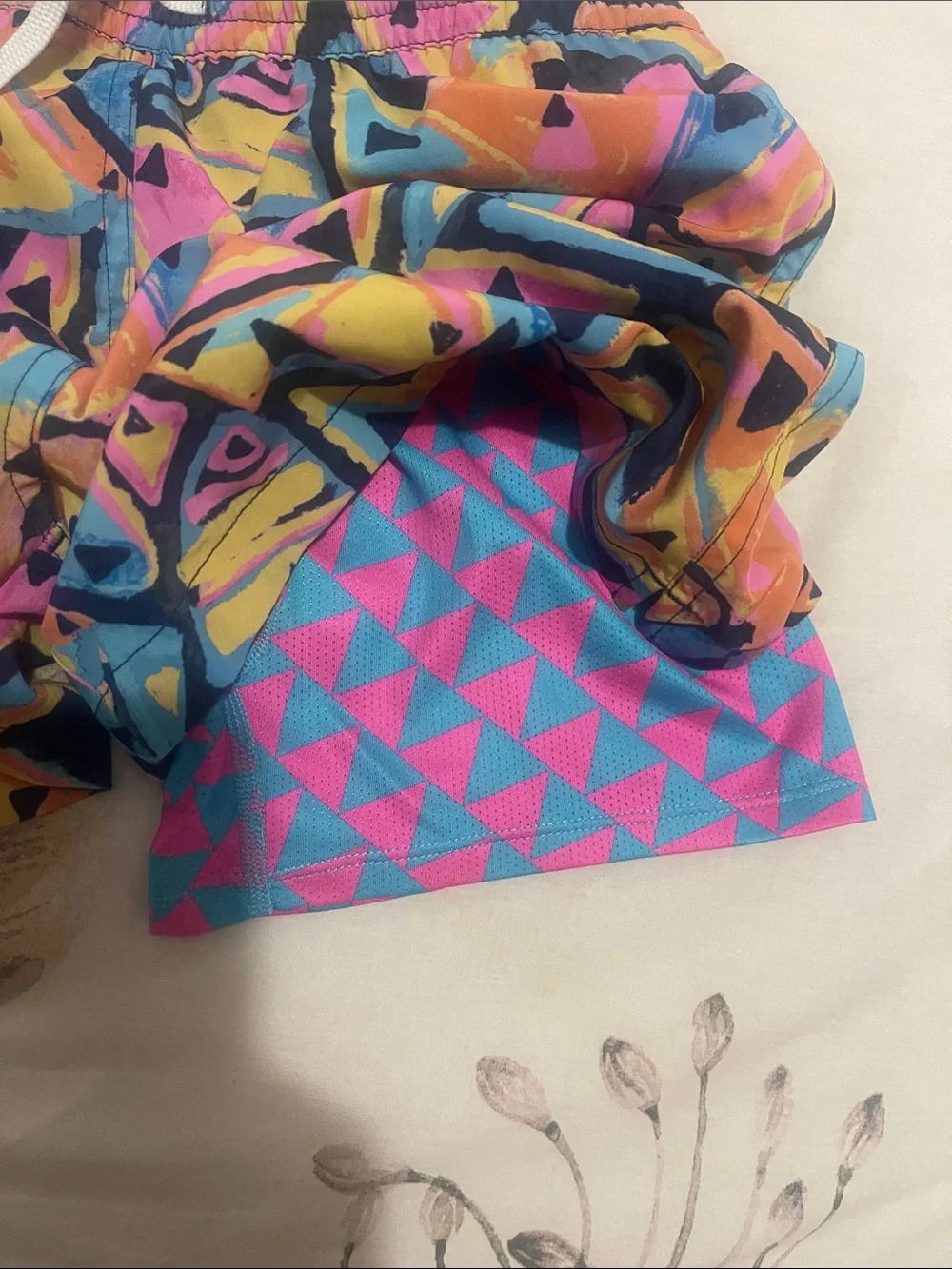 chubbies Kids Neon Geometric Swim Trunks in Pink, Blue, Yellow, Black